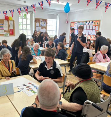 Senior pupils with their grandparents in the classroom of Ibstock Place School.