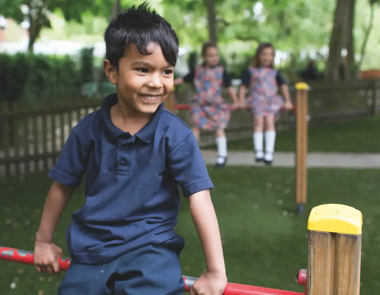 Prep pupils playing in the playground of Ibstock Place School, a private school near Richmond, Barnes, Wandsworth.