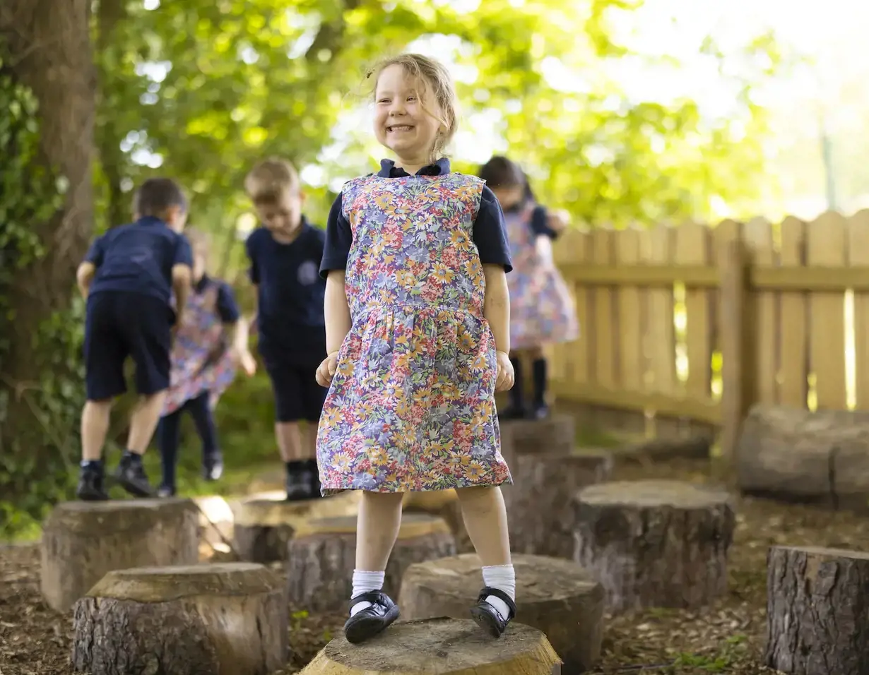 prep pupils playing in the forest school of Ibstock Place School, a private school near Richmond.