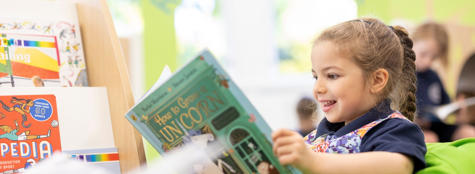 prep pupils reading in the library of Ibstock Place School, a private school near Richmond.