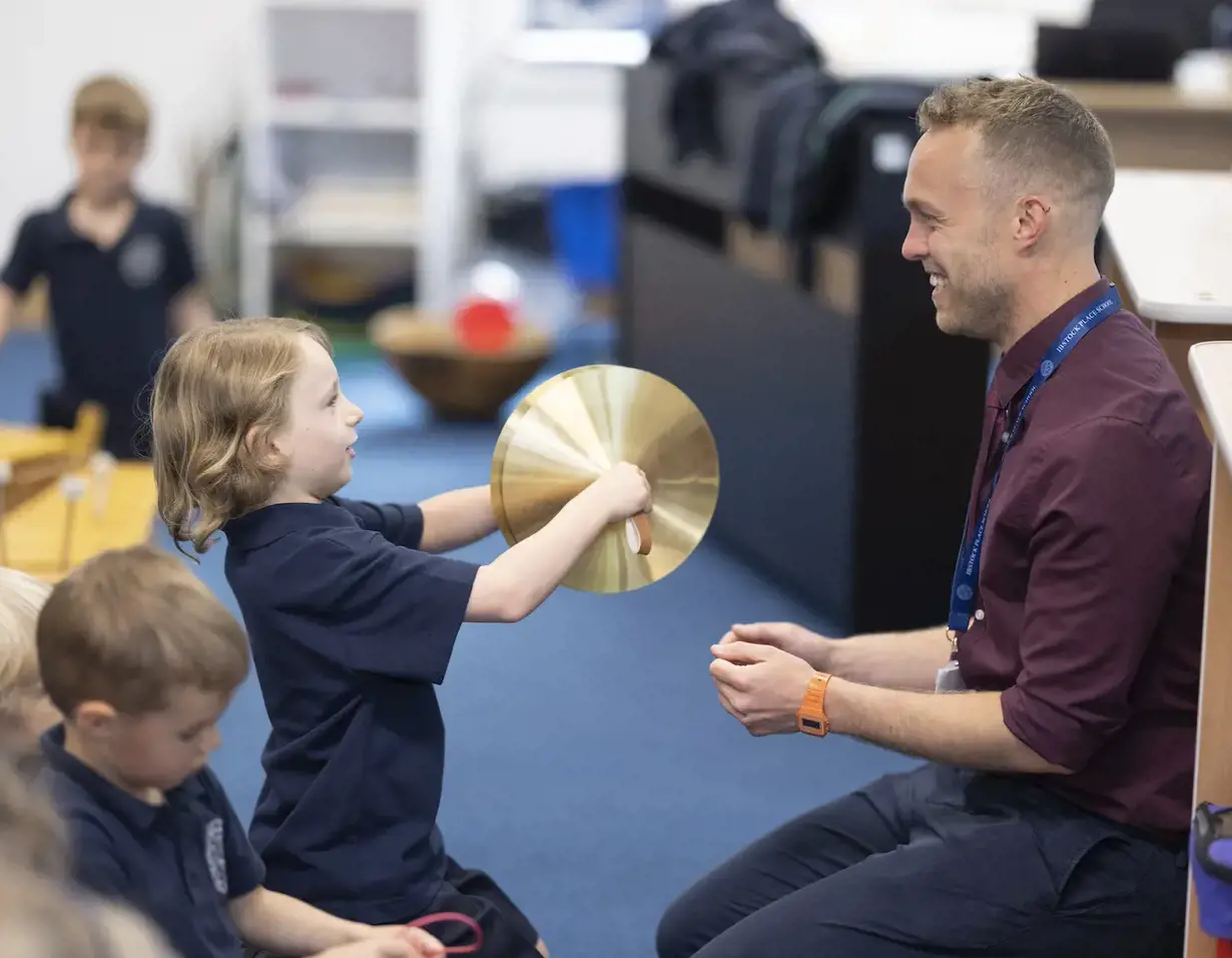 prep pupils learning musical instrument at Ibstock Place School, a private school near Richmond.