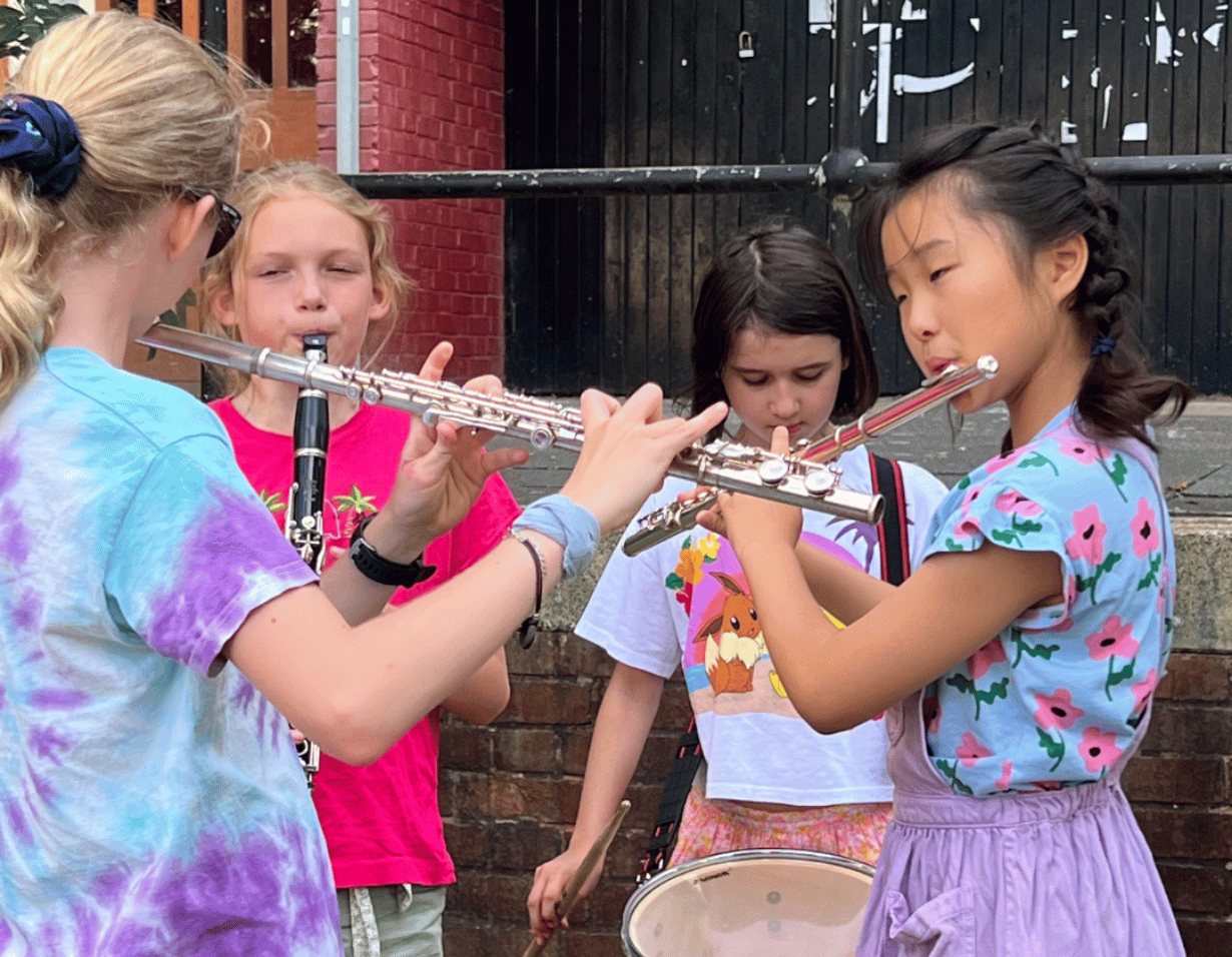 Prep pupil performing a musical instrument at Ibstock Place School, a private school near Richmond.