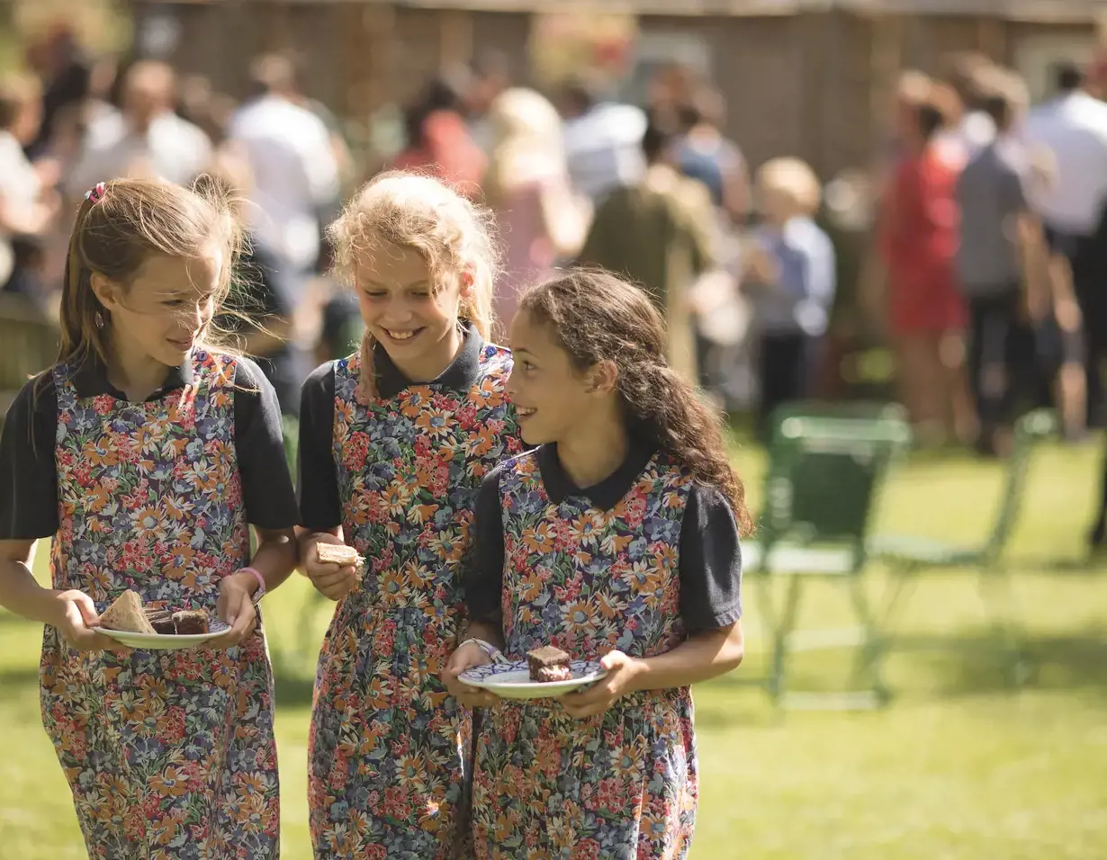 Prep pupils walking on the grounds of Ibstock Place School, a private school near Richmond, Barnes, Putney, Kingston, & Wandsworth