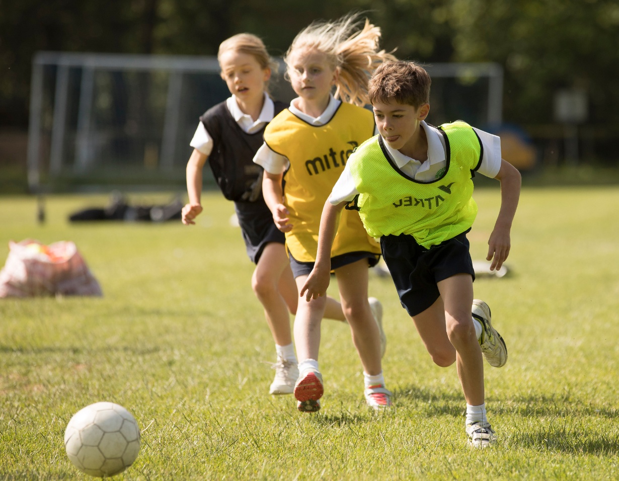 Prep pupils playing football at Ibstock Place School, a private school near Richmond.