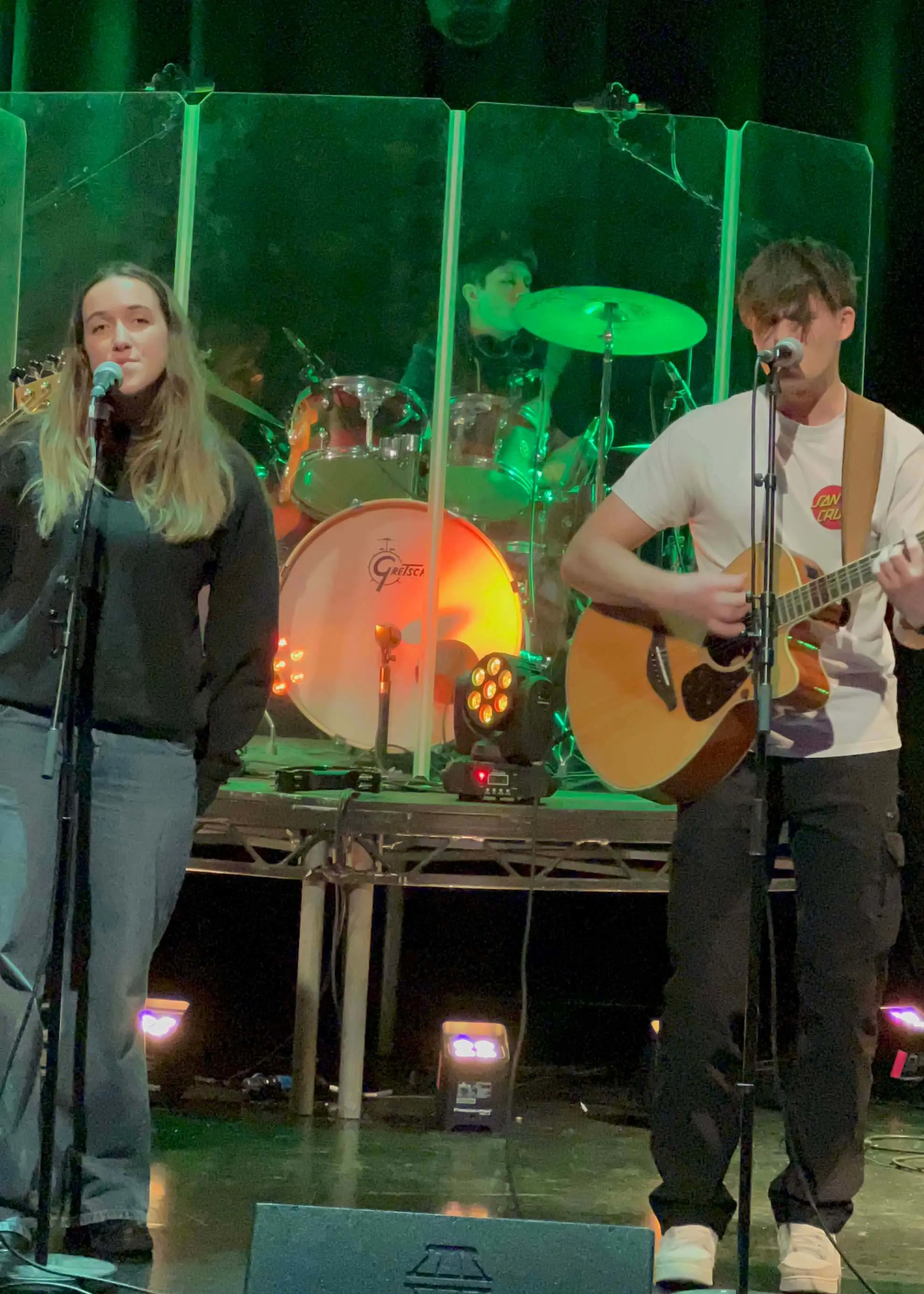 Pupils singing and playing the guitar at Ibstock Place School, Roehampton, a private school near Richmond, Barnes, Putney, Kingston, & Wandsworth