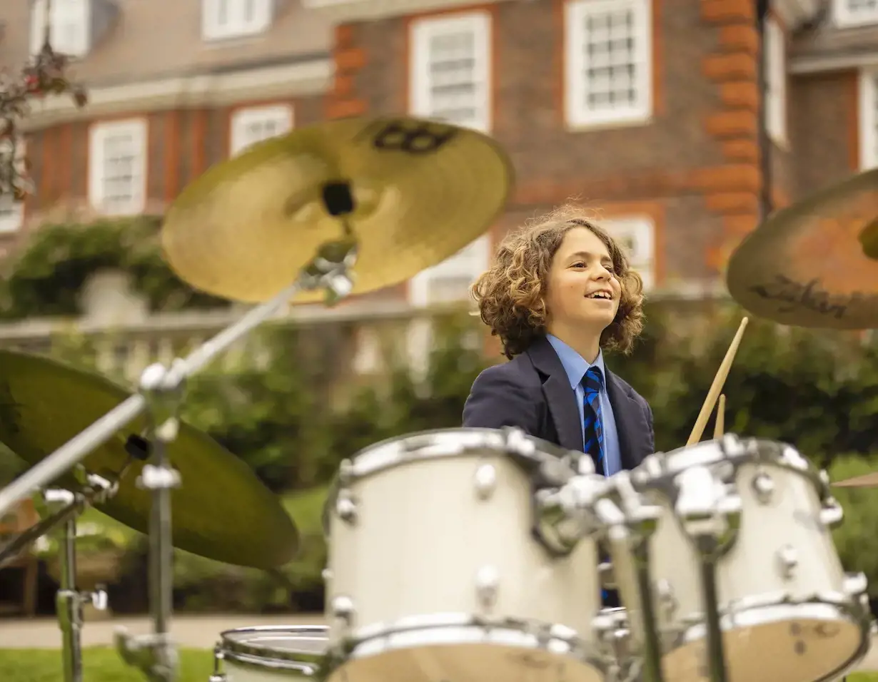 Senior pupils playing a musical instrument at Ibstock Place School, a private school near Richmond, Barnes, Putney, Kingston, and Wandsworth.