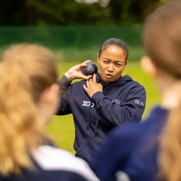 Sixth form pupils playing hockey at Ibstock Place School, a private school near Richmond, Barnes, Putney, Kingston, and Wandsworth.