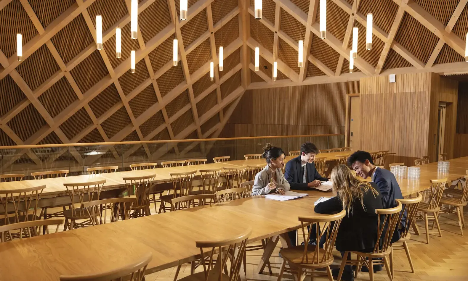 Sixth form pupils studying in the Great hall at Ibstock Place School, a co-educational private school near Richmond, Barnes, Putney, Kingston, and Wandsworth.