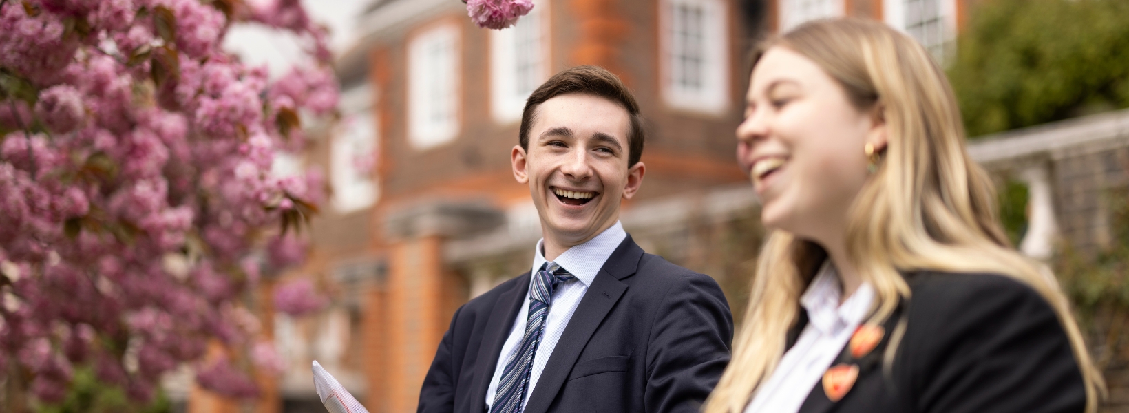 Sixth form pupils walking through the beautiful campus of  Ibstock Place School, a private school near Richmond.