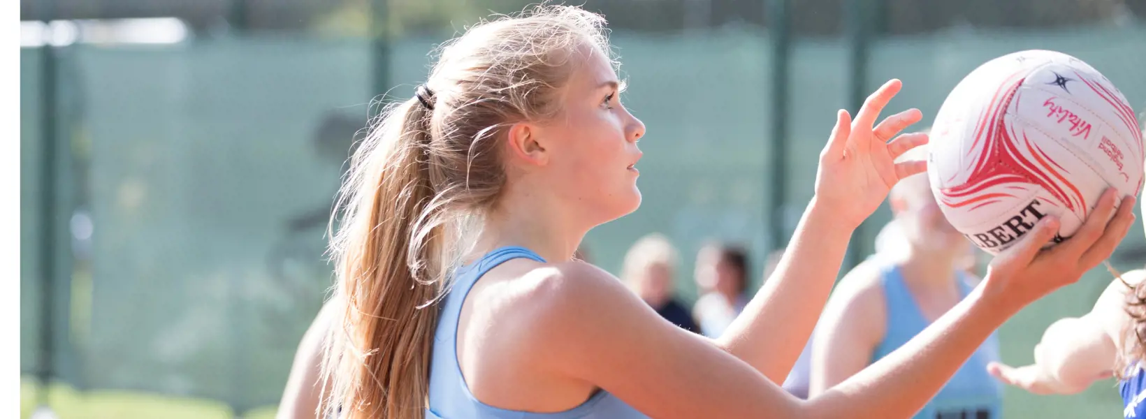 Sixth form pupils playing netball at Ibstock Place School, a private school near Richmond, Barnes, Putney, Kingston, and Wandsworth.